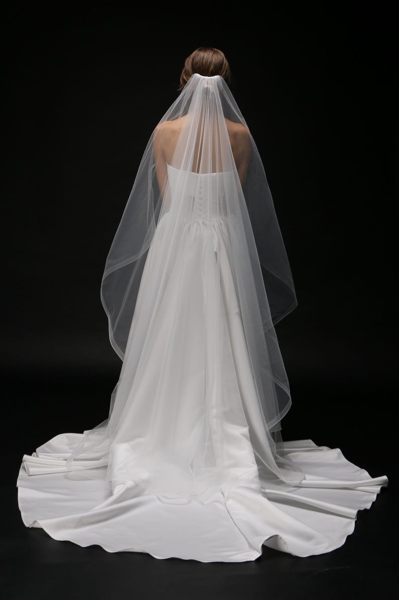bride wearing chapel length veil back view