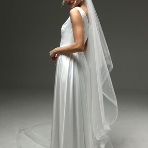 bride wearing dramatic veil long train