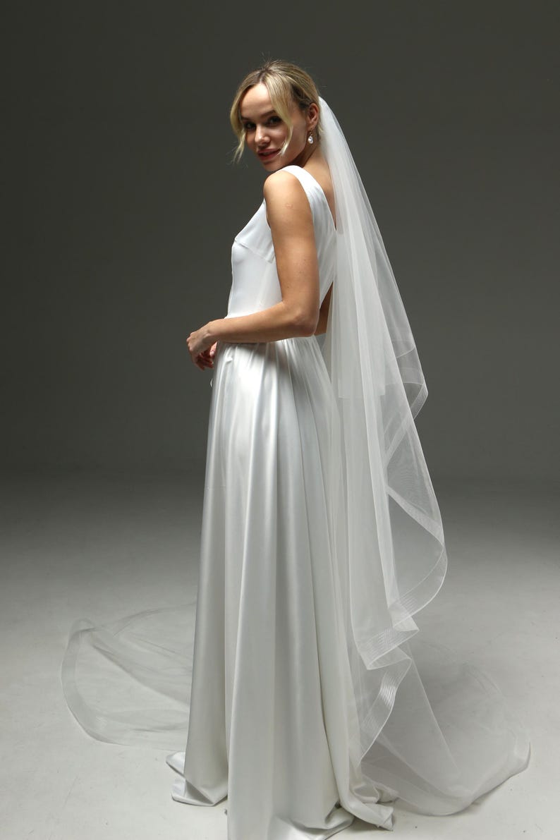 bride wearing dramatic veil long train