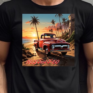 May include: Black t-shirt featuring a vibrant graphic of a red 1953 Ford F-150 truck parked on a beach at sunset. Palm trees and a building are in the background. The text "1953 Ford F-150" is printed below the truck.
