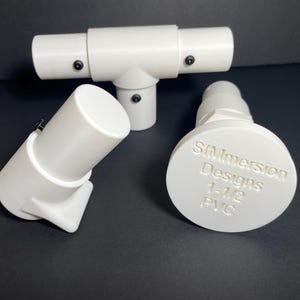 May include: A set of three ceramic mugs with a speckled, matte finish. The mugs are in shades of cream, light gray, and dark gray. Each mug has a simple, minimalist design, perfect for coffee or tea.