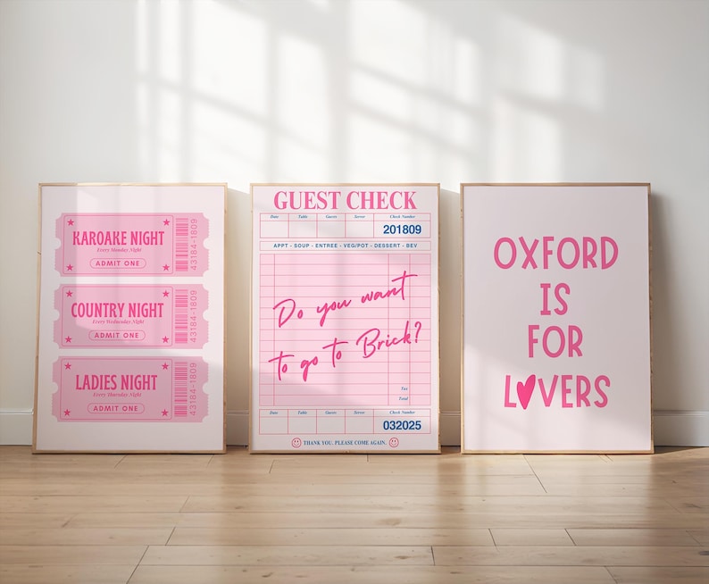 May include: Three framed pink prints. The left print features three tickets for "Karaoke Night", "Country Night", and "Ladies Night". The center print is a pink guest check with the text "Do you want to go to Brick?". The right print says "Oxford is for Lovers".