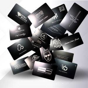 May include: A collection of black business cards with various logos and text, including "RYNO WRAPS", "LIGHTSPEED ELECTRIC", "FRANK CHOY", and "Marcos Medina". The cards are scattered against a white background.