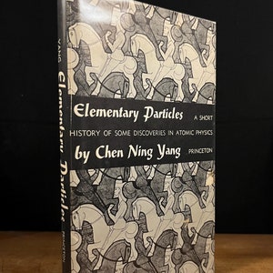 May include: A black and white book cover with a geometric pattern of horses. The title is "Elementary Particles: A Short History of Some Discoveries in Atomic Physics" by Chen Ning Yang.