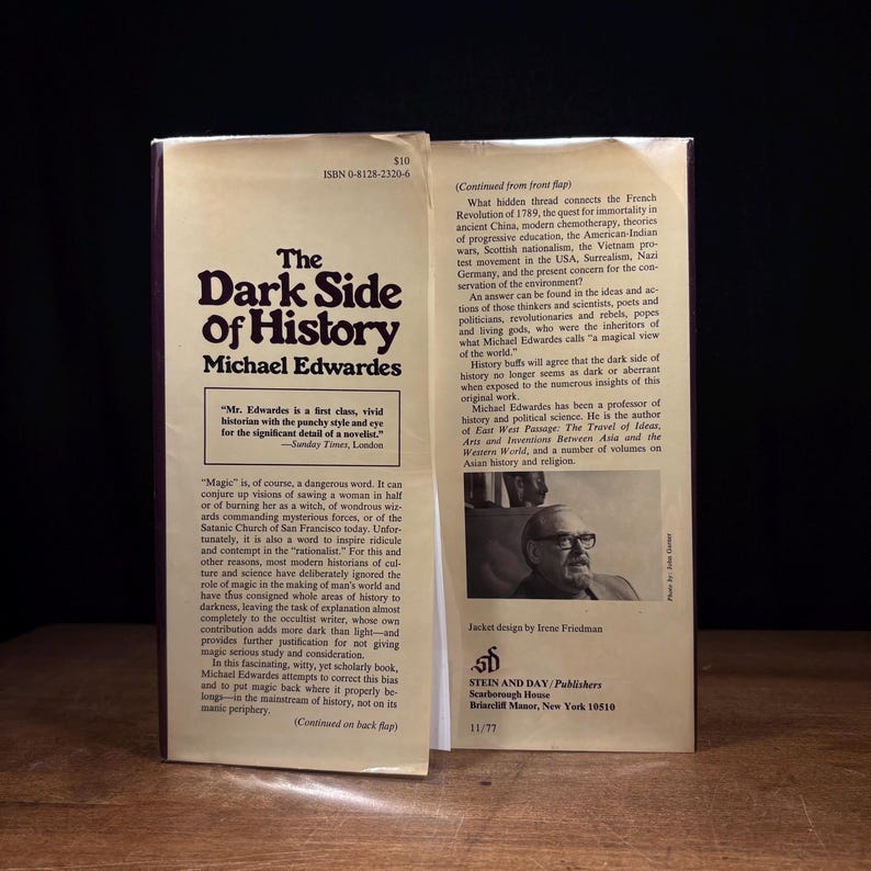May include: A vintage book titled "The Dark Side of History" by Michael Edwardes, with a dark cover and text in a serif font. The book's jacket is open, revealing text and a photo of the author.