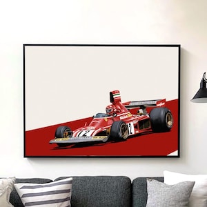 May include: A framed art print featuring a red vintage race car with the number 12 on a red and white background. The artwork is displayed above a gray sofa in a modern living room setting.