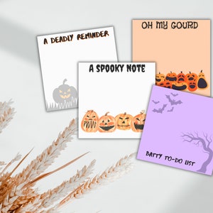 May include: Four printable Halloween themed notepads with pumpkin illustrations and text. The notepads are titled "A Deadly Reminder", "Oh My Gourd", "A Spooky Note", and "Batty To-Do List".