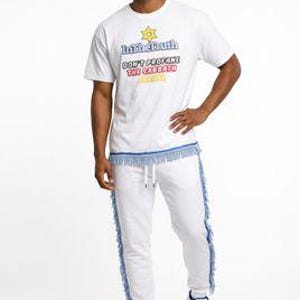 May include: White t-shirt and sweatpants set with blue fringe detailing. The t-shirt features the text "In the Truth" and "Don't Profane the Sabbath". The sweatpants have a drawstring waist and blue fringe down the sides. The person is wearing white sneakers.