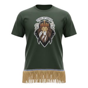 May include: Dark green t-shirt featuring a lion with a crown and the text "TRIBE OF JUDAH". The shirt has a blue and gold trim with fringe at the bottom. The design is centered on the front of the shirt.