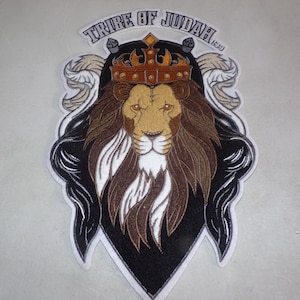 May include: Embroidered patch featuring a lion's head wearing a gold crown with the text "TRIBE OF JUDAH 1:21" above it.