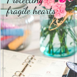 May include: A close-up of a pink carnation bouquet in a blue glass jar, with a planner and the text "Protecting fragile hearts" and "Get the tools you need to support your teen best" on a white surface.