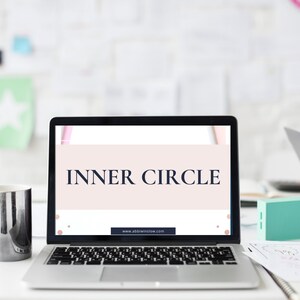 May include: A laptop computer with a white background and the text "INNER CIRCLE" displayed on the screen. The website address "www.abbieinshaw.com" is visible at the bottom of the screen.