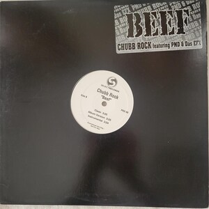 Könnte beinhalten: Ein schwarzes Vinyl-Albumcover für "Beef" von Chubb Rock featuring PMD & Das EFX. Der Albumtitel steht in großen, fetten weißen Buchstaben. Das Label ist Select Records. Das Etikett enthält die Titelzeiten.