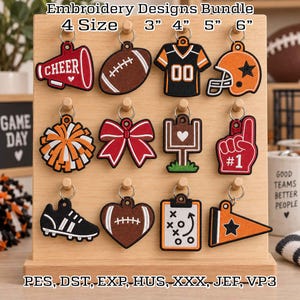 May include: An embroidery designs bundle featuring 12 sports-themed keychains in 3", 4", 5", and 6" sizes. Designs include a megaphone, football, jersey, helmet, pom-pom, bow, goal post, foam finger, cleat, heart football, clipboard, and pennant.