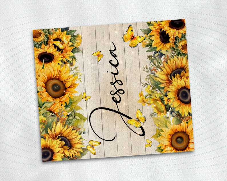 May include: A wood sign with a whitewashed background and a rustic wood grain texture. The sign is decorated with a border of sunflowers and butterflies. The name "Jessica" is written in cursive script on the sign.