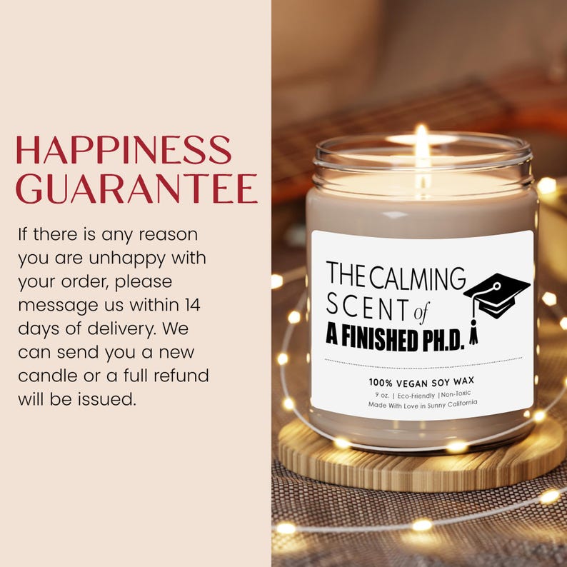 The image is a promotional image for a candle product. It features a candle in a jar with a label that reads "The Calming Scent of a Finished PhD." The candle is placed on a wooden surface, and there is a text overlay providing a guarantee for the product.