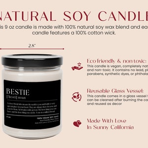 a white candle with a black lid labeled bestie