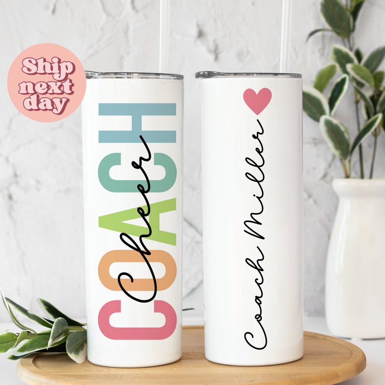 two personalized tumbles sitting on top of a wooden tray