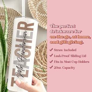 a hand holding a white tumbler with the words, the perfect drinkware for