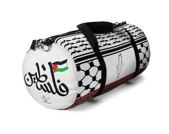May include: A cylindrical duffel bag with a white background. The bag features a black and white pattern, a Palestinian flag, and Arabic text. A black strap runs across the top. The bag has a map of Palestine.