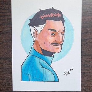 May include: A hand-drawn illustration of a man with dark hair, a mustache, and a blue turtleneck sweater. The artwork features a light blue circle behind the man's head and is signed "CR '25".