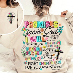 Puede incluir: Una sudadera beige con un estampado gráfico colorido que dice "Promises from God I Will" e incluye versículos bíblicos. El gráfico también incluye una cruz y flores.