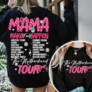 May include: Black sweatshirt with pink and white checkered design and the text "Mama Make it all Happen The Motherhood Tour".