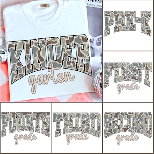 May include: White t-shirt with the word "KINDERgarten" in a camouflage pattern. Additional images show "PRE-K", "FIRST grade", "SECOND grade", "THIRD grade", and "FOURTH grade" in the same style. The shirts are suitable for back-to-school.