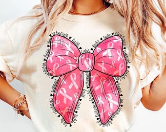 May include: A pink watercolor ribbon bow with the words "hope, joy, survivor, courage, support, faith, cure, light, love, courage, support, survivor, hope, joy, believe, brave, strength, faith, cure, fight" surrounding it.