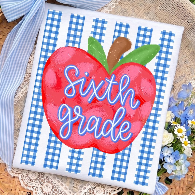 May include: A rectangular white sign featuring a blue and white gingham pattern background. Centered on the sign is a large red apple illustration with green leaves and a brown stem. The text Sixth grade is written in blue script.