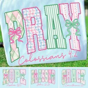 May include: A light blue fabric with the word "PRAY" in large, decorative letters. The letters are filled with patterned designs and outlined in pink and green. The text "Colossians 4:2" is written below in pink.