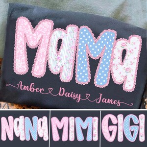 May include: Dark gray blanket with the word "MAMA" in large, decorative letters. The letters are in pink floral, blue polka dot, and striped patterns. Below the word are the names "Amber", "Daisy", and "James". Additional text includes "NANA", "MIMI", and "GIGI".