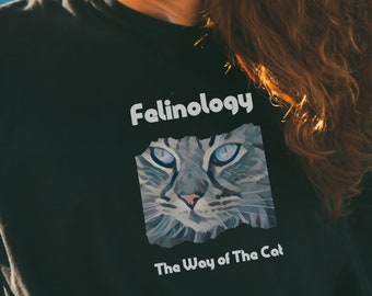 May include: Black t-shirt with a white graphic of a cat's face and the text "Felinology The Way of The Cat"