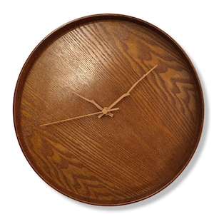 May include: A round wooden wall clock with a brown wood grain finish and gold-colored hands.