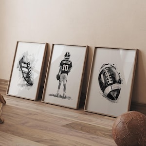May include: Three black and white watercolor prints in frames. The prints feature a football, a football player, and a football cleat.