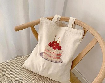 Bolsa de lona de algodão com estampa de bolo de cereja, design de inspiração vintage.