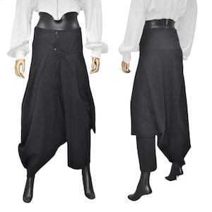 May include: Black pants with a wide leg and a gathered design. The pants have a high waist and a belt.