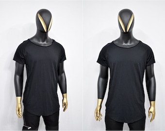 May include: A black longline t-shirt with a round neckline and short sleeves. The shirt is made of a soft, comfortable fabric and has a relaxed fit.