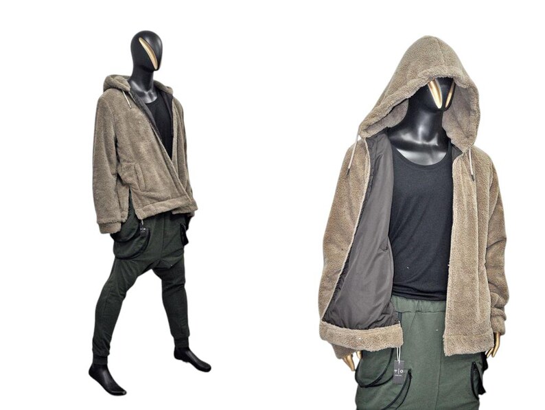 May include: A brown hooded jacket with a zipper closure, paired with a black tank top and dark green cargo pants. The jacket has a soft, textured appearance. The pants have multiple pockets and a unique design.