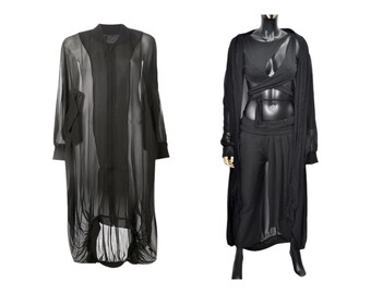 May include: Two black sheer long-sleeved shirts. One shirt is buttoned up and the other is open with a black top underneath.