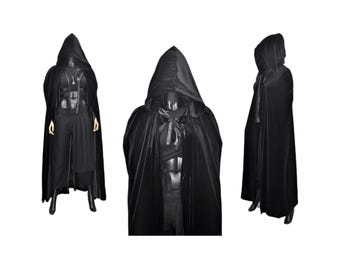 May include: Three black velvet hooded cloaks with long sleeves and a flowing design.