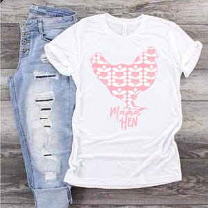 May include: White t-shirt with a pink chicken silhouette and the text "Mama Hen".