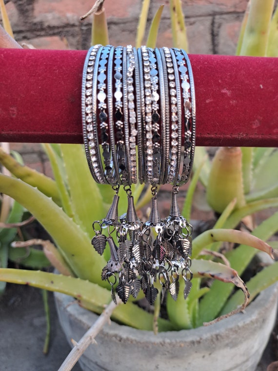 Black metal bangles with cheap hangings