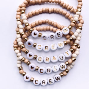 JGA bracelets "BRAUT & CREW" white/gold with glass beads in beige cream gold on elastic silicone band - handmade