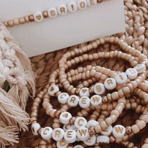 JGA bracelets “BRIDE & CREW” white beige gold with glass beads on an elastic silicone band - handmade