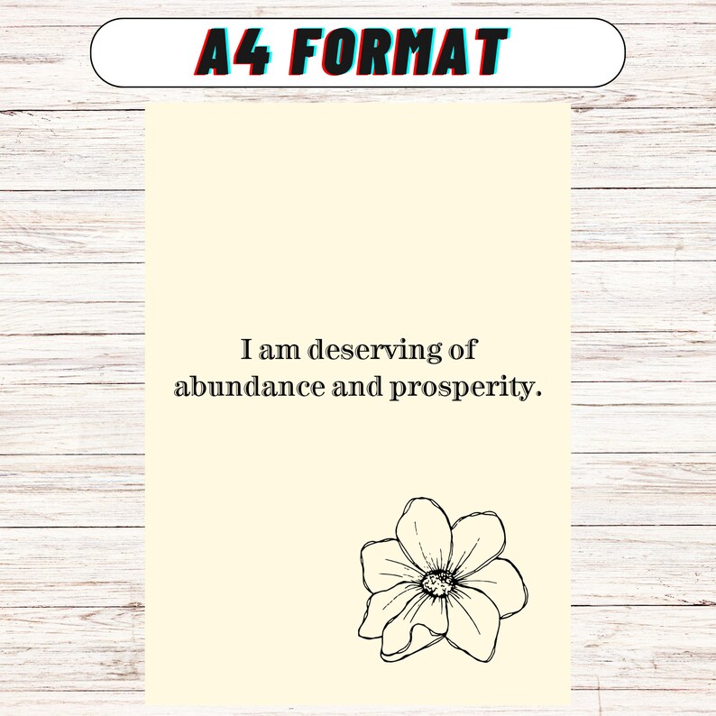 May include: A cream-colored printable affirmation card with black text that reads "I am deserving of abundance and prosperity." A black and white line drawing of a flower is at the bottom of the card.