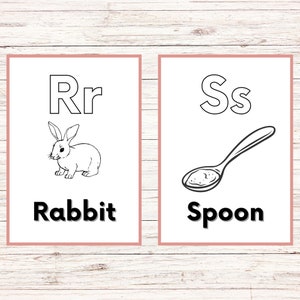 May include: Two black and white flashcards with the letters R and S. The R card has a picture of a rabbit and the word "Rabbit" below it. The S card has a picture of a spoon and the word "Spoon" below it.