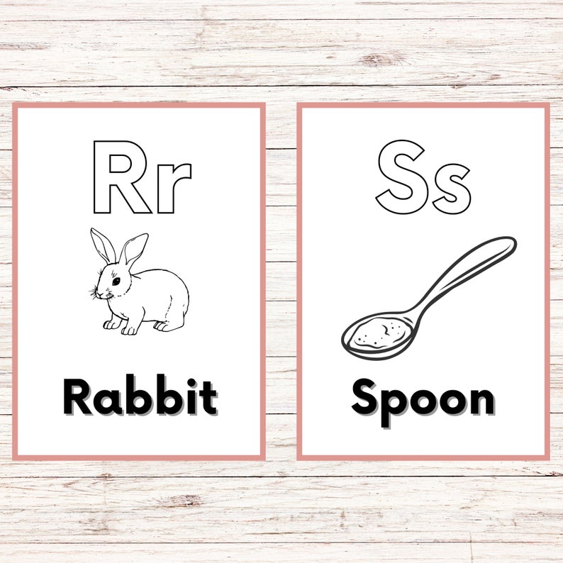 May include: Two black and white flashcards with the letters R and S. The R card has a picture of a rabbit and the word "Rabbit" below it. The S card has a picture of a spoon and the word "Spoon" below it.