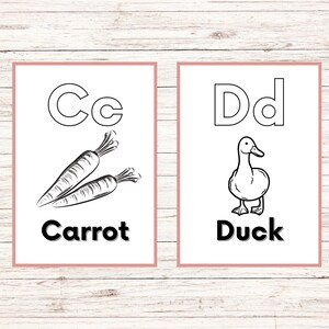 May include: Two black and white flashcards with the letters C and D. The C card has a picture of two carrots and the word "Carrot" below. The D card has a picture of a duck and the word "Duck" below.