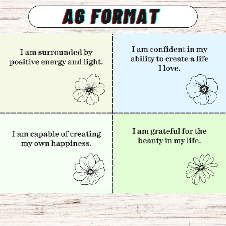 May include: Four affirmation cards with floral illustrations. The cards are light green, light blue, and yellow. The text on the cards reads: "I am surrounded by positive energy and light." "I am confident in my ability to create a life I love." "I am capable of creating my own happiness." "I am grateful for the beauty in my life."